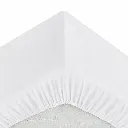 Coin de drap-housse blanc immaculé.webp